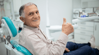 Senior Smiling at the Dentist