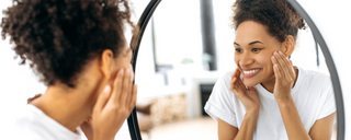 Black lady looking in the mirror