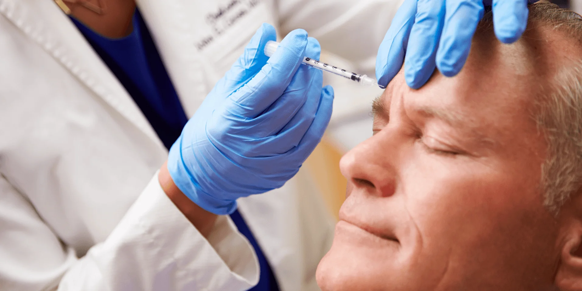 Clinician injecting Botox into a patient’s forehead to reduce fine lines.