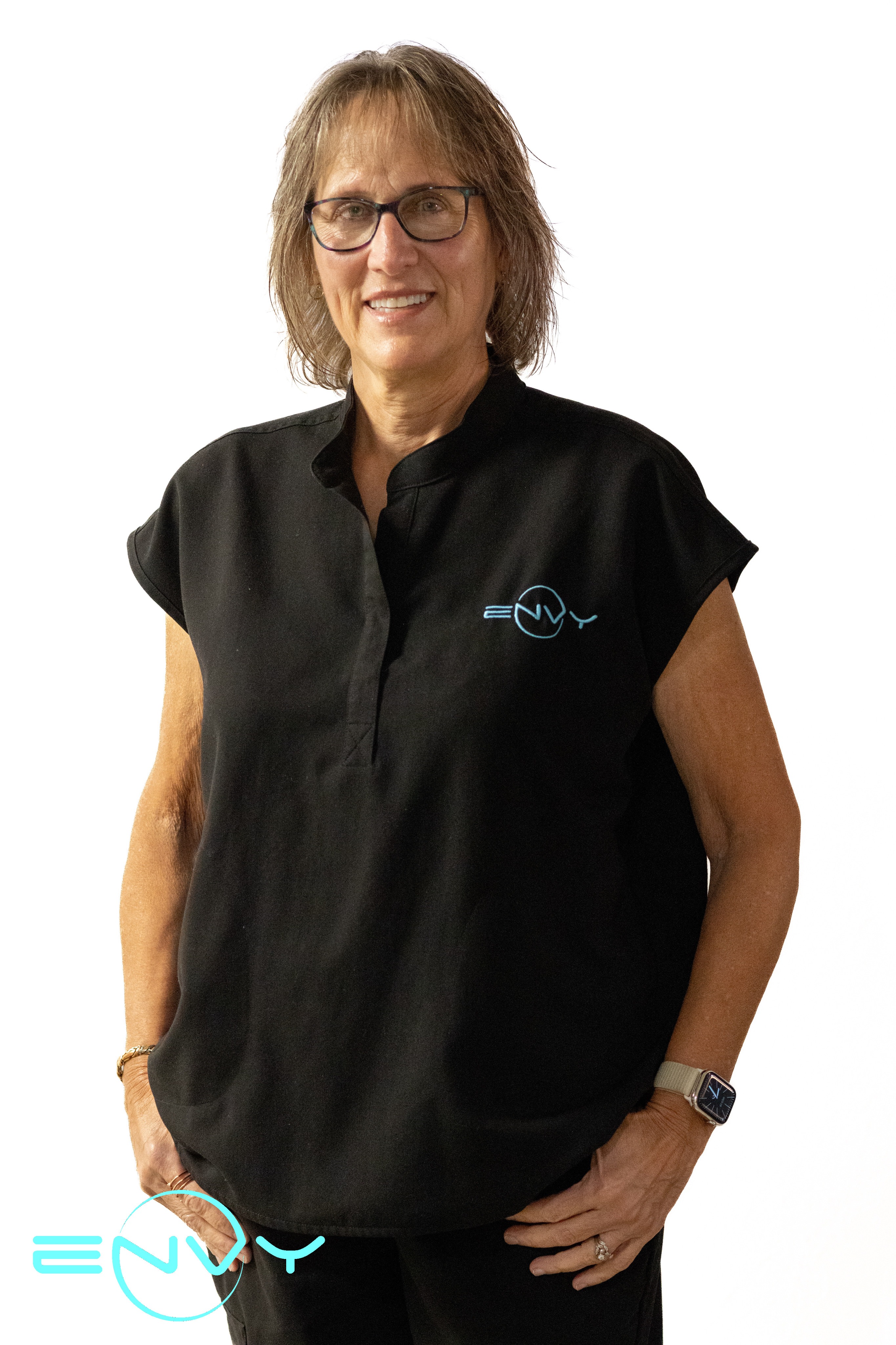 Office manager Kathy from ENVY Dental smiling in black scrubs.